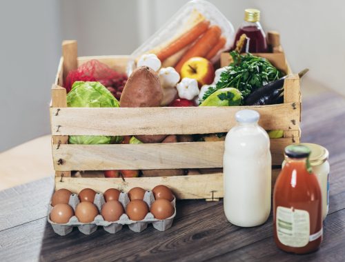 fresh organic groceries in a wooden box. supply from local producers.