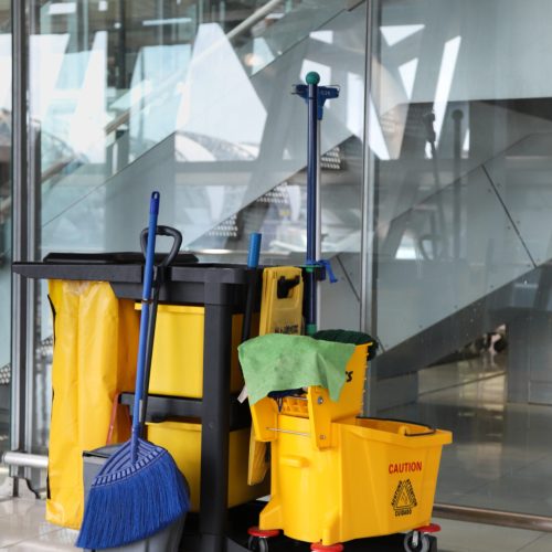 closeup of janitorial, cleaning equipment and tools for floor cleaning. vertical view.